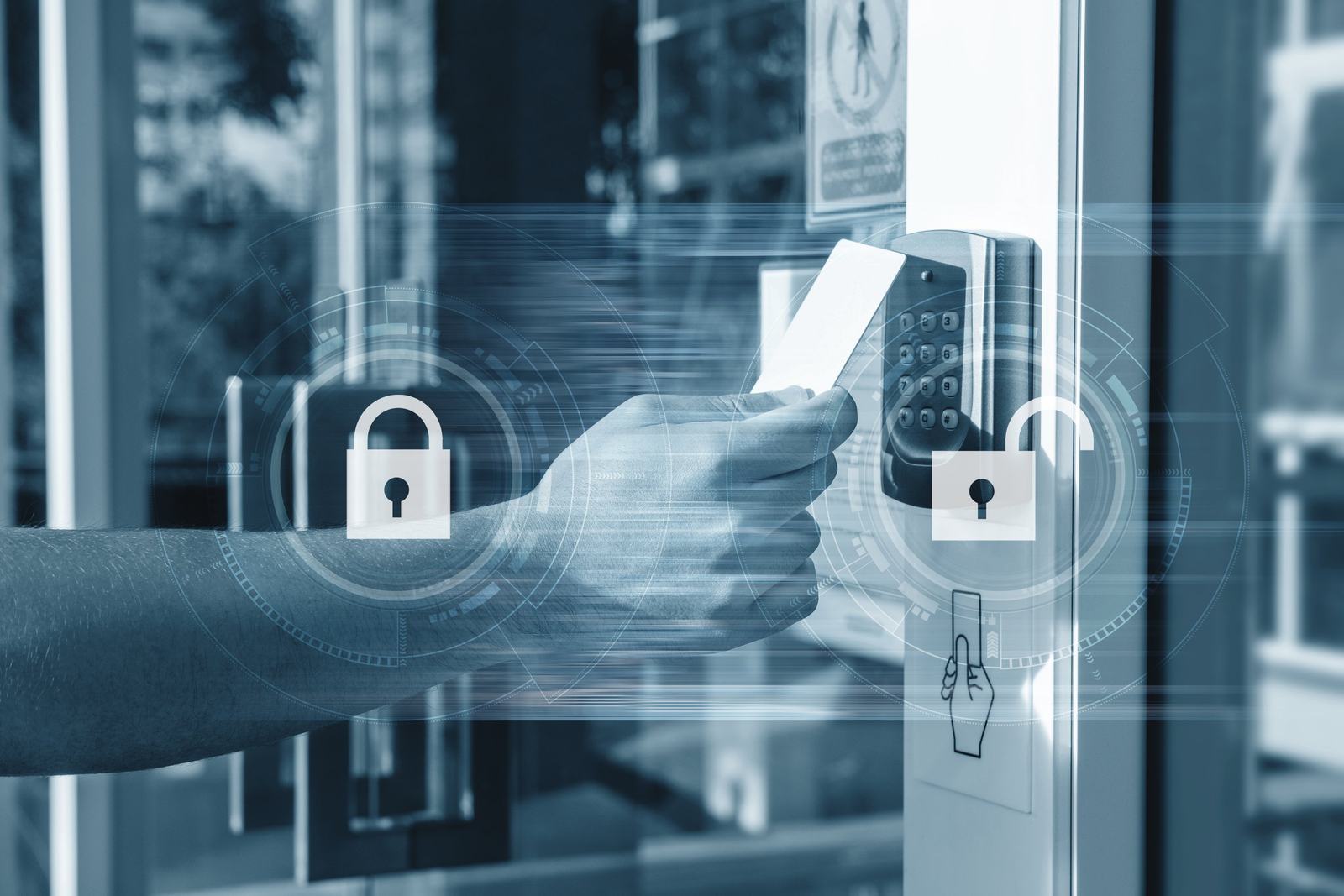 Staff member tapping an access card on a door reader